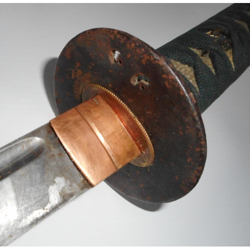 302 - Japanese sword. 60cm fullered blade. Rusted iron tsuba. In lacquered scabbard.2