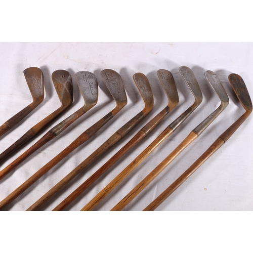 Nine hickory shafted golf clubs including D Anderson and Sons of