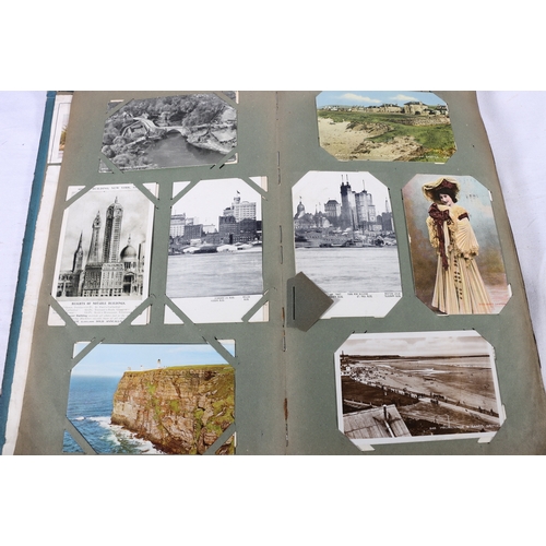 203 - An Edwardian postcard album containing approximately 200 postcards, much topographical interest incl... 