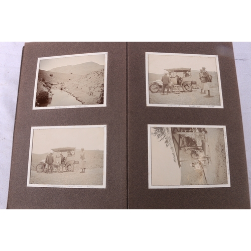 207 - Framed photograph of a Scotsman in Highland dress, four photograph albums containing early motor car... 