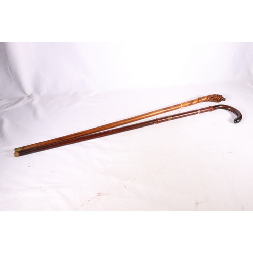 376 - Howell of London walking stick with sliding door torch compartment and a walking stick with handle c... 