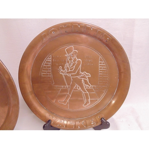 158A - Pair of Johnnie Walker whisky advertising Arts and Crafts style copper trays, 34cm diameter