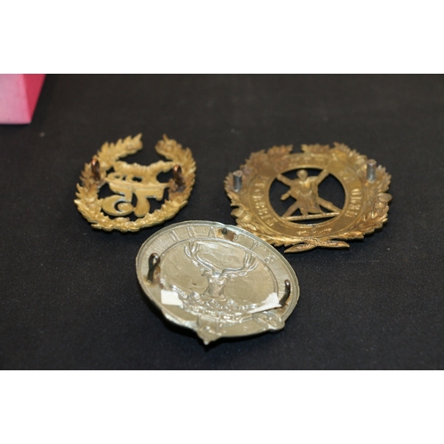 335 - Gordon Highlanders cap badges including a circular belt with stag and By Dand example (Clan Gordon t... 