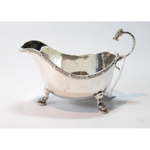 126 - Silver sauce boat with celtic embossed border by Brook & Son (Sheffield) 1936, 5oz.