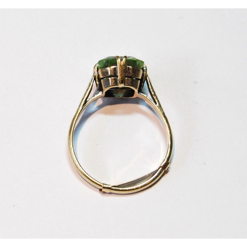 13 - Ring with pale green spinel in 9ct gold, size V.