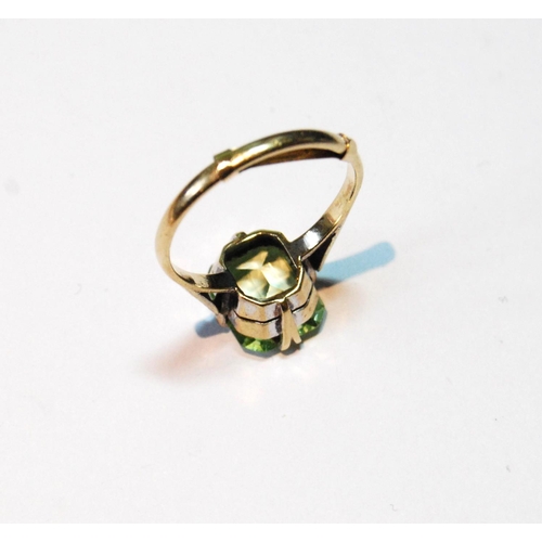 13 - Ring with pale green spinel in 9ct gold, size V.