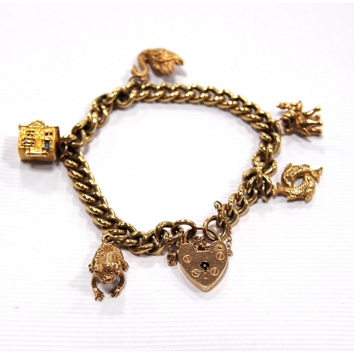 149 - 9ct gold charm bracelet, 32g.