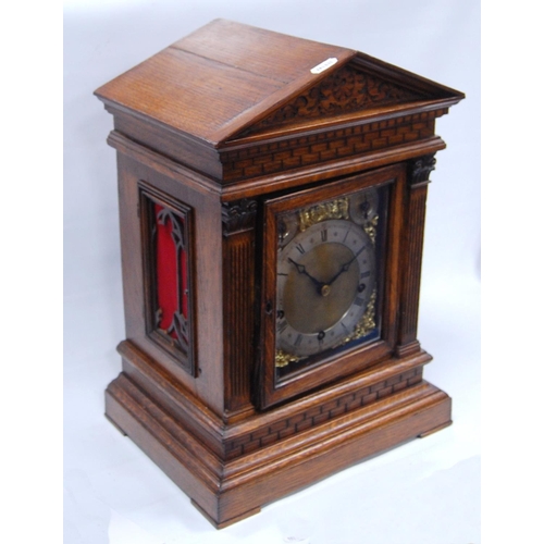 161 - Oak cased Palladian mantel clock with brass face, applied chapter rings and spandrels, Roman and Ara... 