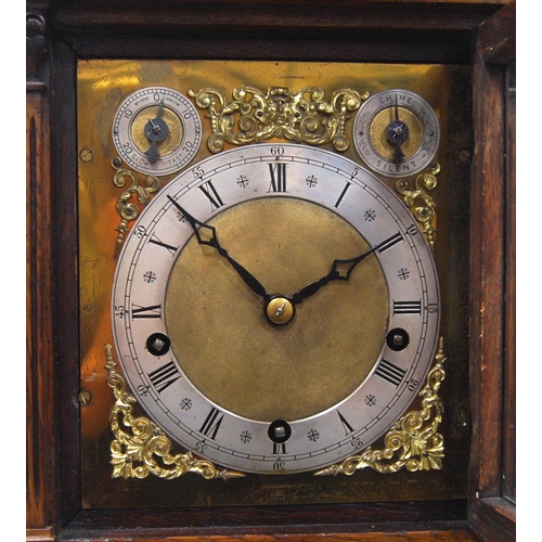 161 - Oak cased Palladian mantel clock with brass face, applied chapter rings and spandrels, Roman and Ara... 