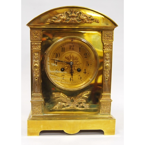 163 - Continental brass mantel clock with arched pediment with Arabic numerals flanked by columns, raised ... 