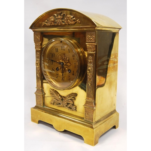 163 - Continental brass mantel clock with arched pediment with Arabic numerals flanked by columns, raised ... 