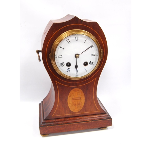 177 - Mahogany mantel clock with enamelled circular face, Roman numerals, boxwood inlaid trunk with urn lo... 