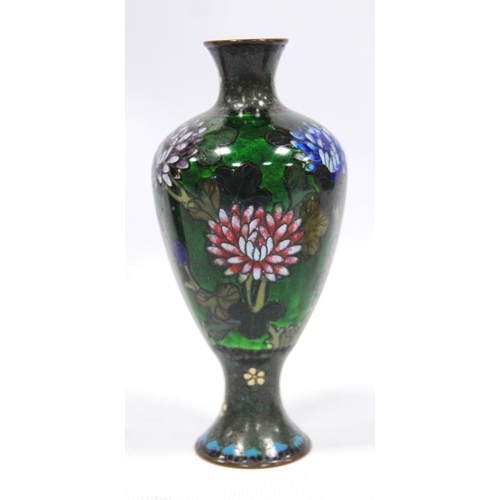 179 - Three cloisonné vases, two with black ground decorated with cranes, the third with green ground, chr... 