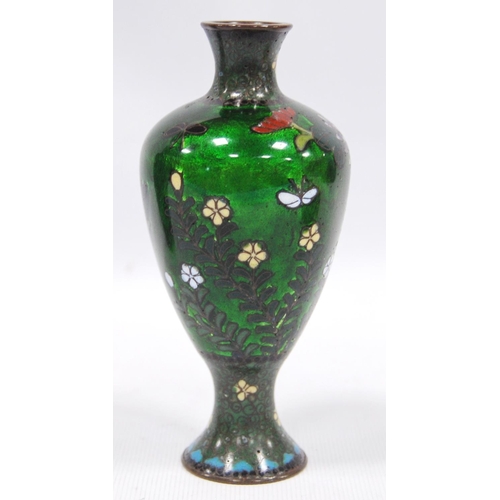 179 - Three cloisonné vases, two with black ground decorated with cranes, the third with green ground, chr... 