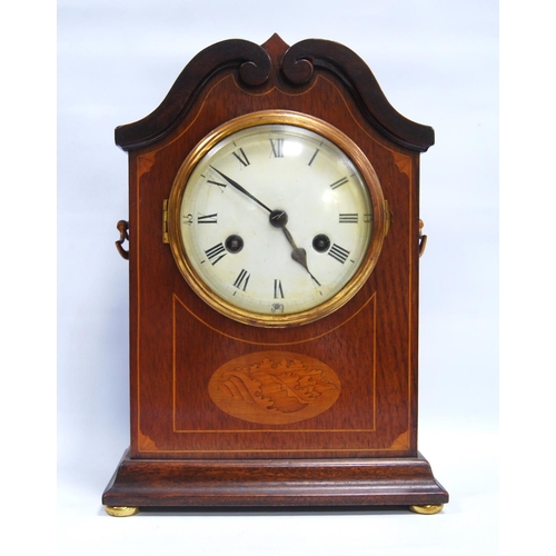 185 - Mahogany and inlaid mantel clock with circular enamelled face, Roman and Arabic numerals, scroll ped... 