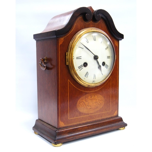 185 - Mahogany and inlaid mantel clock with circular enamelled face, Roman and Arabic numerals, scroll ped... 