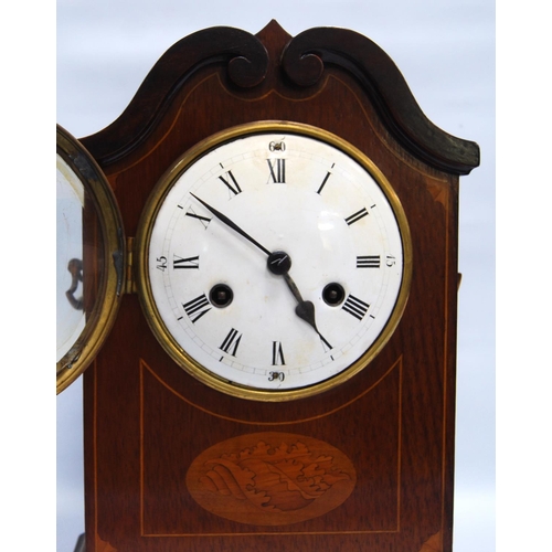 185 - Mahogany and inlaid mantel clock with circular enamelled face, Roman and Arabic numerals, scroll ped... 