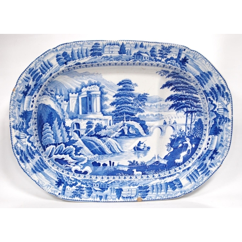 192 - 19th century blue and white meat plate with shaped base, 52cm wide and 38cm deep.