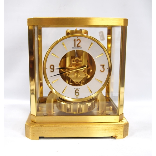 201 - Jaeger-LeCoultre Atmos clock with white chapter ring and Arabic numerals, 21cm wide and 23.5cm high.