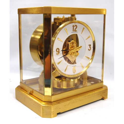 201 - Jaeger-LeCoultre Atmos clock with white chapter ring and Arabic numerals, 21cm wide and 23.5cm high.