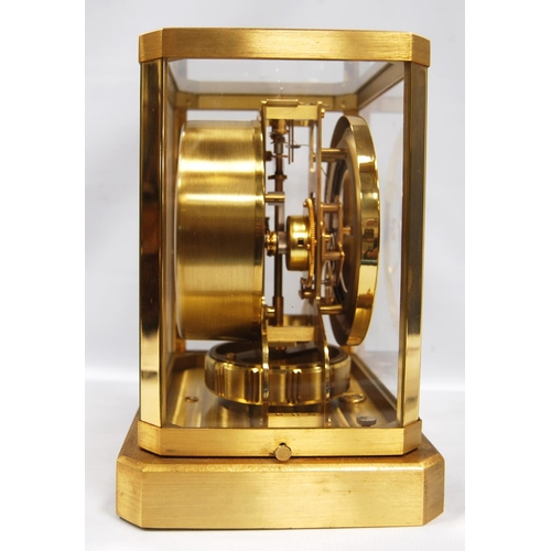 201 - Jaeger-LeCoultre Atmos clock with white chapter ring and Arabic numerals, 21cm wide and 23.5cm high.