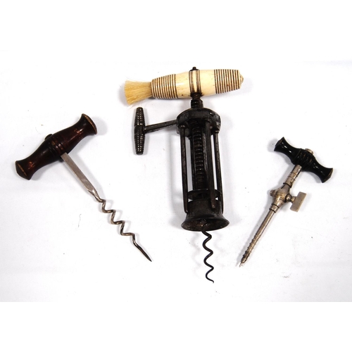 202 - Three vintage corkscrews, one stamped 'Fortnum & Mason'.   (3)