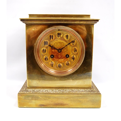 204 - Late 19th century brass mantel clock with stepped cornice over circular face, Arabic numerals, flora... 