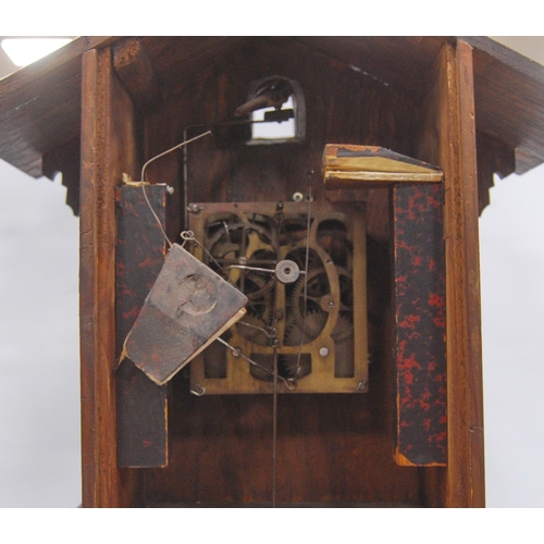 222 - Black Forest cuckoo clock with fretwork pediment over turned face, Roman numerals, flanked by carved... 