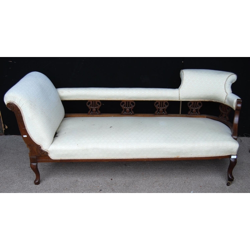 347 - Edwardian mahogany chaise longue with cushioned top rail over elaborate supports, cushioned left arm... 