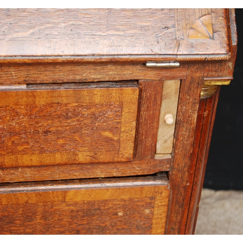 349 - George III oak bureau bookcase, the projected moulded cornice over shell inlaid panelled doors flank... 