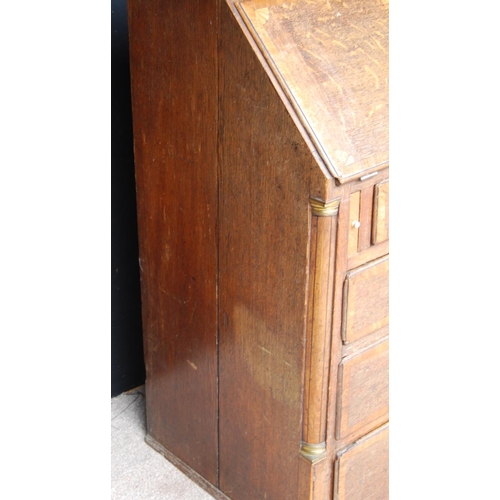 349 - George III oak bureau bookcase, the projected moulded cornice over shell inlaid panelled doors flank... 