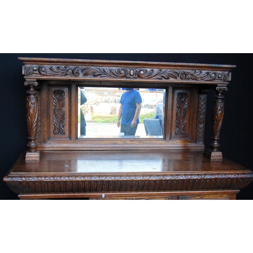 353 - Large late Victorian oak sideboard, the projected moulded cornice over carved frieze, mirrored back ... 