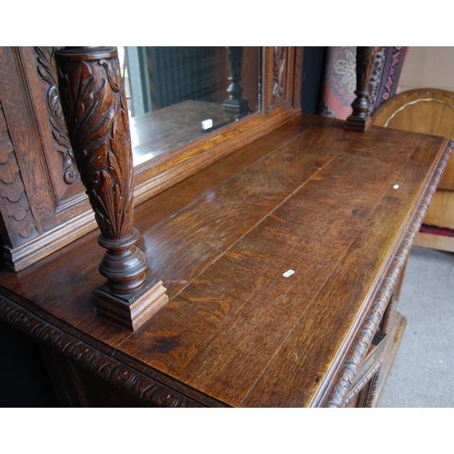 353 - Large late Victorian oak sideboard, the projected moulded cornice over carved frieze, mirrored back ... 