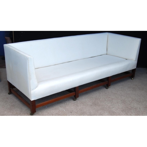 356 - Mahogany framed three-seat sofa of simple rectangular form with loose cushions raised on square legs... 