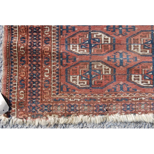 357 - Afghan rug with two rows of ten guls over red ground and geometric border, 135cm x 93cm.