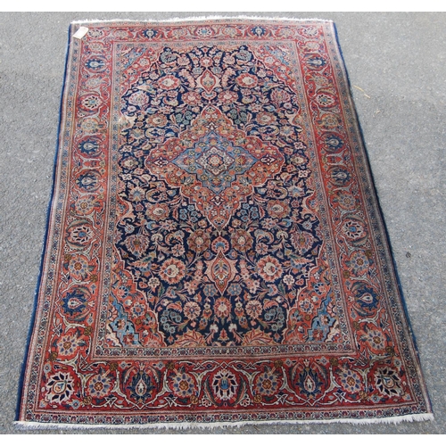 358 - Ushak rug with central floral medallion over blue ground, all over floral design, spandrels and bord... 