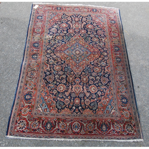 358 - Ushak rug with central floral medallion over blue ground, all over floral design, spandrels and bord... 