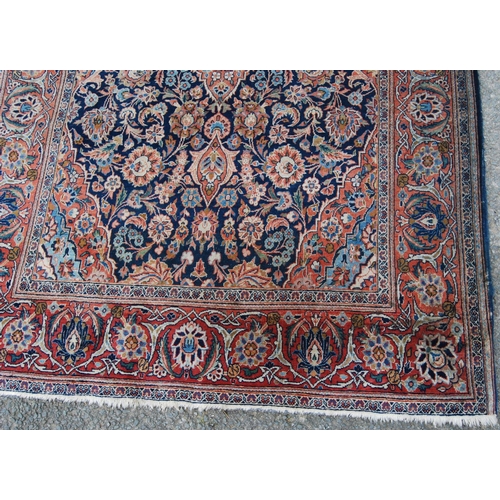 358 - Ushak rug with central floral medallion over blue ground, all over floral design, spandrels and bord... 