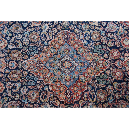 358 - Ushak rug with central floral medallion over blue ground, all over floral design, spandrels and bord... 