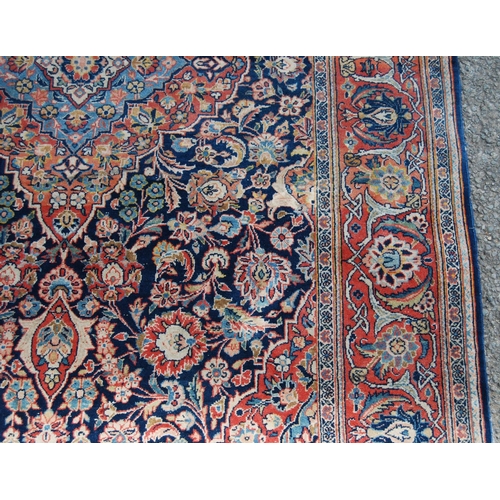 358 - Ushak rug with central floral medallion over blue ground, all over floral design, spandrels and bord... 