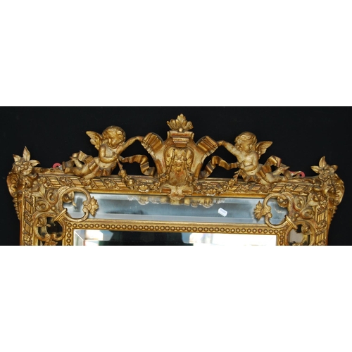 364 - 19th century gilt wall mirror mounted by cartouche flanked by cherubs, cushioned bevelled glass plat... 