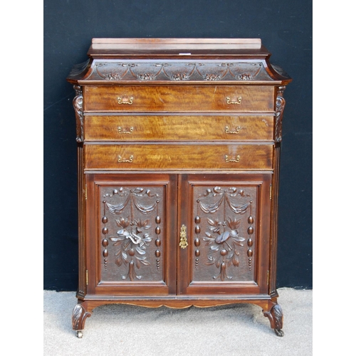 367 - Carved mahogany music cabinet, the stepped top over floral carved frieze, three drawers, floral carv... 