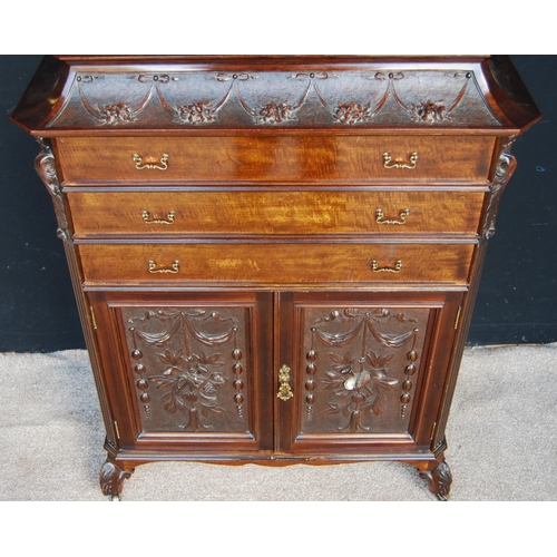 367 - Carved mahogany music cabinet, the stepped top over floral carved frieze, three drawers, floral carv... 