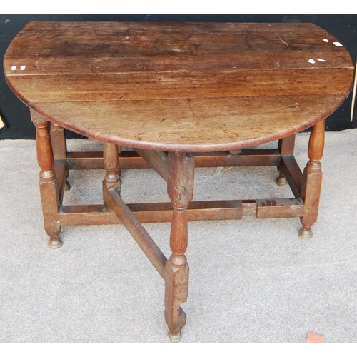 368 - Oak gateleg table, the oval top raised on block and baluster turned legs united by stretcher, 119cm ... 