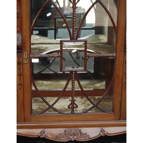 369 - Late 19th century mahogany display cabinet, the projected cornice over stepped top, glazed door encl... 