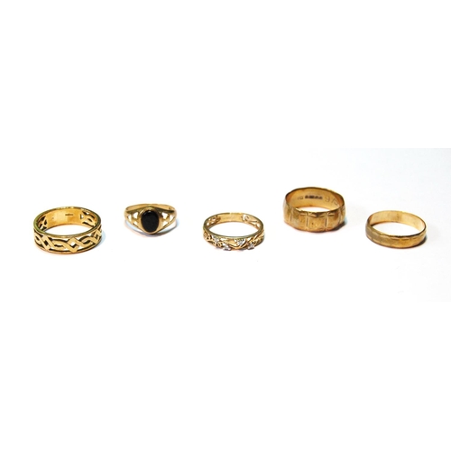 37 - Two gold openwork rings and three others, all 9ct, 14g.