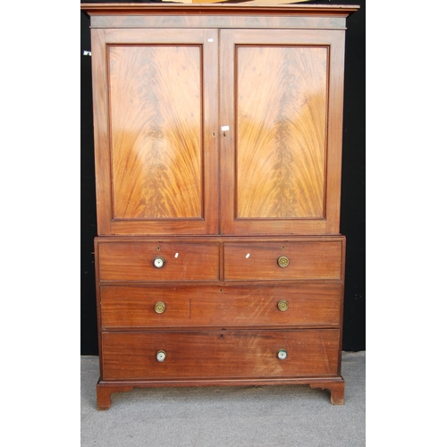 372 - Late 19th century mahogany linen press, the projected moulded cornice over panelled doors enclosing ... 