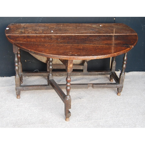 373 - Late 17th or early 18th century oak gateleg table, the oval drop flap top raised on block and turned... 