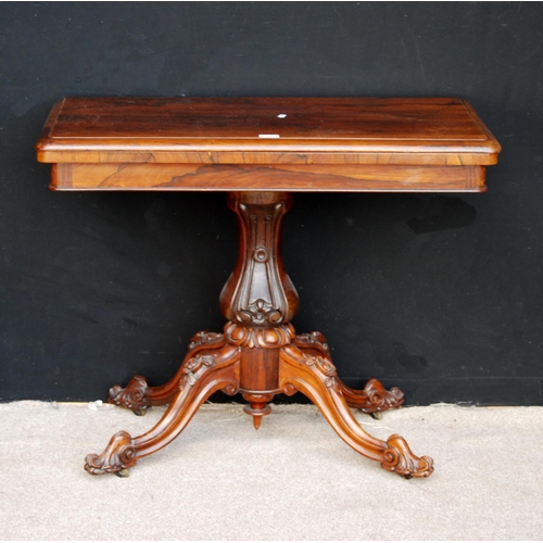 377 - Victorian rosewood card table, the moulded rectangular top enclosing baize lining, raised on carved ... 