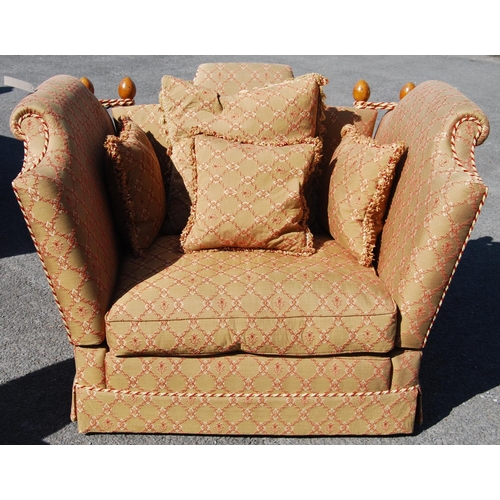 378 - Large contemporary Knoll armchair with turned finials, drop arms and loose cushions.